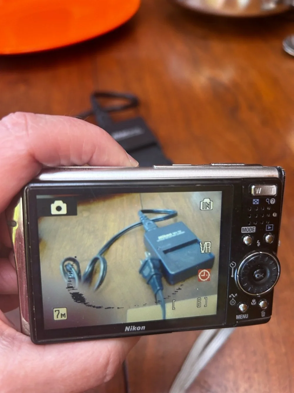 Three NEW lithium ion batteries; used charger for Nikon Coolpix camera.